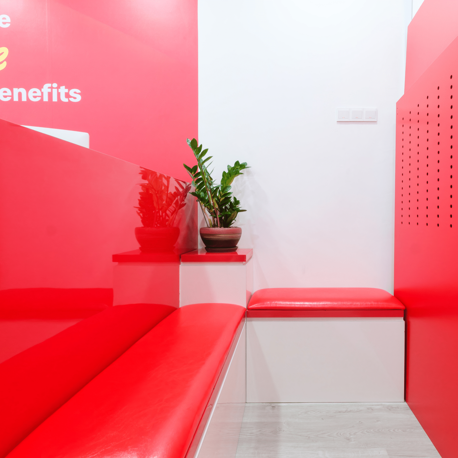 Red cushioned benches in the waiting area of this top Tampines money lender's office